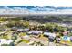 Aerial view of a residential neighborhood with houses, trees, and green spaces at 660 Flamingo Dr, Apollo Beach, FL 33572