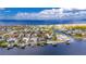 Aerial view of a waterfront property, highlighting its location in a neighborhood with docks at 6613 Seabird Way, Apollo Beach, FL 33572