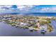 Stunning aerial view of waterfront home in a luxurious community at 6613 Seabird Way, Apollo Beach, FL 33572