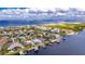 Aerial view of a waterfront community with various homes and docks at 6613 Seabird Way, Apollo Beach, FL 33572