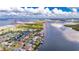 Aerial view of the property and surrounding waterfront area at 6613 Seabird Way, Apollo Beach, FL 33572