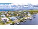 Impressive aerial view of a waterfront property with a pool and private dock at 6613 Seabird Way, Apollo Beach, FL 33572