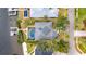 An aerial view of a waterfront home with a pool, dock, and lush landscaping at 6613 Seabird Way, Apollo Beach, FL 33572