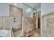 Walk-in shower with tile surround, built-in bench, and recessed lighting at 6613 Seabird Way, Apollo Beach, FL 33572