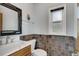 Bathroom with updated vanity, tiled walls, and modern fixtures at 6613 Seabird Way, Apollo Beach, FL 33572