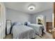 Bedroom with two twin beds, a ceiling fan, and a window with natural light at 6613 Seabird Way, Apollo Beach, FL 33572