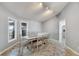 Dining area with table, chairs, and large windows at 6613 Seabird Way, Apollo Beach, FL 33572
