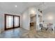 Entryway with double doors, tile floors, and views into living spaces at 6613 Seabird Way, Apollo Beach, FL 33572