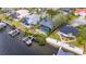 Exterior elevation showcasing waterfront home with pool and dock in a neighborhood setting at 6613 Seabird Way, Apollo Beach, FL 33572