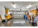 Spacious two-car garage with storage cabinets and epoxy floor at 6613 Seabird Way, Apollo Beach, FL 33572