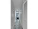 Hallway with tile flooring leading to bedrooms at 6613 Seabird Way, Apollo Beach, FL 33572
