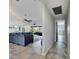 Hallway leading to a living room with a view of the pool at 6613 Seabird Way, Apollo Beach, FL 33572