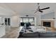 Living Room with large sliding doors offering waterfront views at 6613 Seabird Way, Apollo Beach, FL 33572