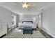 Spacious main bedroom with ceiling fan, tile flooring, and large bed at 6613 Seabird Way, Apollo Beach, FL 33572