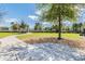 Community dog park with walking path and shaded seating areas at 7020 Feather Wood Dr, Sun City Center, FL 33573