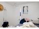 Bedroom with a bed, an open door, and a partially visible bathroom at 8303 N Mulberry St, Tampa, FL 33604