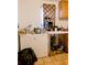 Kitchen area with white appliances, wood cabinetry, and countertops at 8303 N Mulberry St, Tampa, FL 33604