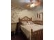 Tropical-themed bedroom with bamboo-style furniture and wall decor at 8384 Antwerp Cir, Port Charlotte, FL 33981