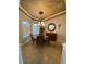 Dining room with chandelier, decorative ceiling, and large windows at 8384 Antwerp Cir, Port Charlotte, FL 33981