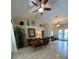 Living room with tile floors, high ceilings, and lots of natural light at 8384 Antwerp Cir, Port Charlotte, FL 33981