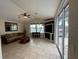 Living room with vaulted ceilings, tile floors, and water views at 8384 Antwerp Cir, Port Charlotte, FL 33981
