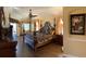 Large main bedroom with dark wood floors and furniture at 8384 Antwerp Cir, Port Charlotte, FL 33981