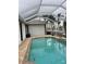 Inviting screened-in pool with a spacious deck at 8384 Antwerp Cir, Port Charlotte, FL 33981