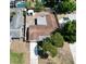 An aerial view showcasing the home's roof, yard, and neighboring houses at 8391 76Th Ave, Seminole, FL 33777