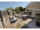 Inviting backyard seating area with comfortable furniture, a fire pit, and partial fence perfect for outdoor gatherings and relaxation at 8391 76Th Ave, Seminole, FL 33777
