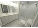 Updated bathroom featuring double vanity, marble tile, and a spacious shower at 8391 76Th Ave, Seminole, FL 33777