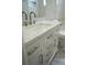 Modern bathroom with white vanity, quartz countertop, and brushed nickel fixtures at 8391 76Th Ave, Seminole, FL 33777