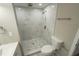 Modern bathroom with a walk-in shower and marble tile surround at 8391 76Th Ave, Seminole, FL 33777