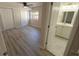 Bright, airy bedroom with wood-look laminate flooring and ceiling fan at 8391 76Th Ave, Seminole, FL 33777