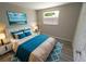 Well-lit bedroom with a full-size bed, modern decor, laminate flooring, and a window providing a view of the lush green exterior at 8391 76Th Ave, Seminole, FL 33777