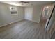 Spacious bedroom with wood-look laminate flooring and ceiling fan at 8391 76Th Ave, Seminole, FL 33777