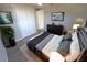 Spacious bedroom boasting a king-size bed, laminate floors, ample closet space, and tasteful decor, creating a relaxing ambiance at 8391 76Th Ave, Seminole, FL 33777