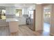 Updated kitchen with white shaker cabinets, quartz countertops, and stainless steel appliances at 8391 76Th Ave, Seminole, FL 33777