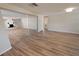 Open living area with wood-look flooring and sliding mirrored doors at 8391 76Th Ave, Seminole, FL 33777