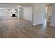 Living room with wood-look flooring, fireplace, and sliding mirrored doors at 8391 76Th Ave, Seminole, FL 33777