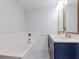 Elegant bathroom with double vanity, soaking tub, and decorative tile floor at 912 Channelside Dr # 2412, Tampa, FL 33602