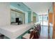 Clubhouse kitchen with bar seating, refrigerator, and access to the outdoors at 912 Channelside Dr # 2412, Tampa, FL 33602