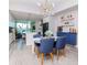 Dining area with round table, blue chairs, and a bar area at 912 Channelside Dr # 2412, Tampa, FL 33602