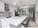 Stylish kitchen featuring a large island, white cabinets, and stainless steel appliances at 912 Channelside Dr # 2412, Tampa, FL 33602
