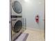 This laundry room features a stacked washer and dryer and a laundry mat at 912 Channelside Dr # 2412, Tampa, FL 33602