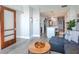Spacious living room with blue sectional sofa, wood accents, and adjacent kitchen and dining area at 912 Channelside Dr # 2412, Tampa, FL 33602