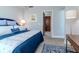 The Primary bedroom features blue and white bedding and a soft rug at 912 Channelside Dr # 2412, Tampa, FL 33602