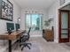A spacious home office featuring a large window, dual monitors, and a comfortable workspace at 912 Channelside Dr # 2412, Tampa, FL 33602