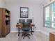 Home office with two computer monitors, a comfortable chair, and a window at 912 Channelside Dr # 2412, Tampa, FL 33602