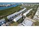 An aerial view of a waterfront townhouse community at 9487 Tara Cay Ct, Seminole, FL 33776