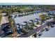 Aerial view of townhouses with parking and landscaping at 9487 Tara Cay Ct, Seminole, FL 33776